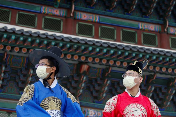 Men wear masks to prevent contracting coronavirus in Seoul